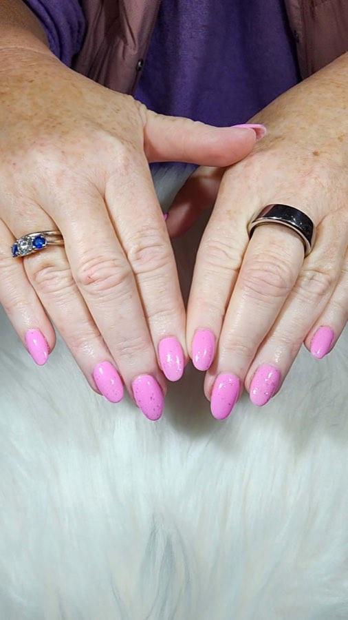 Soft pink polish with statement rings